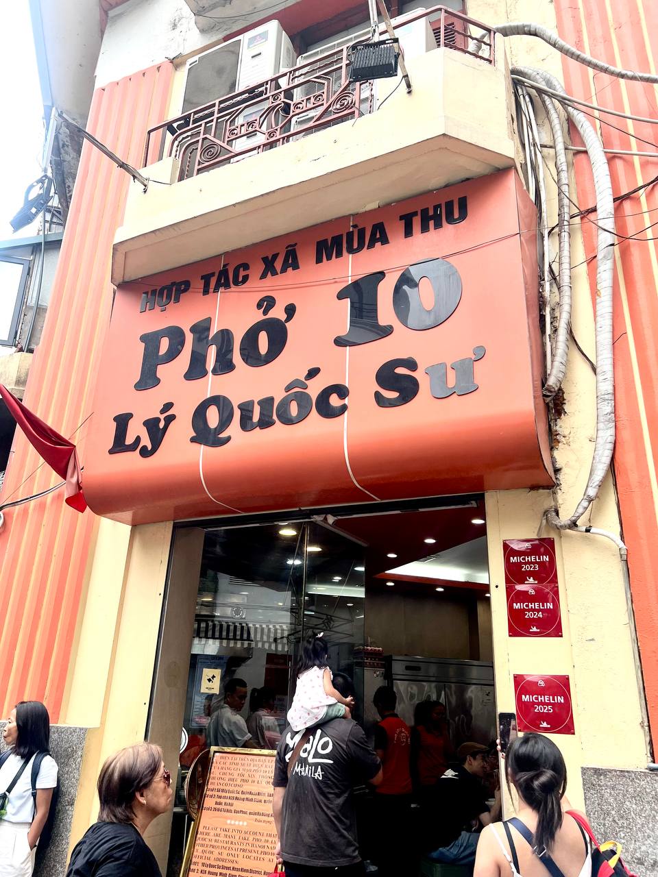 Pho 10 Ly Quoc Su — Michelin plates from 2023, 2024, and 2025 on the wall