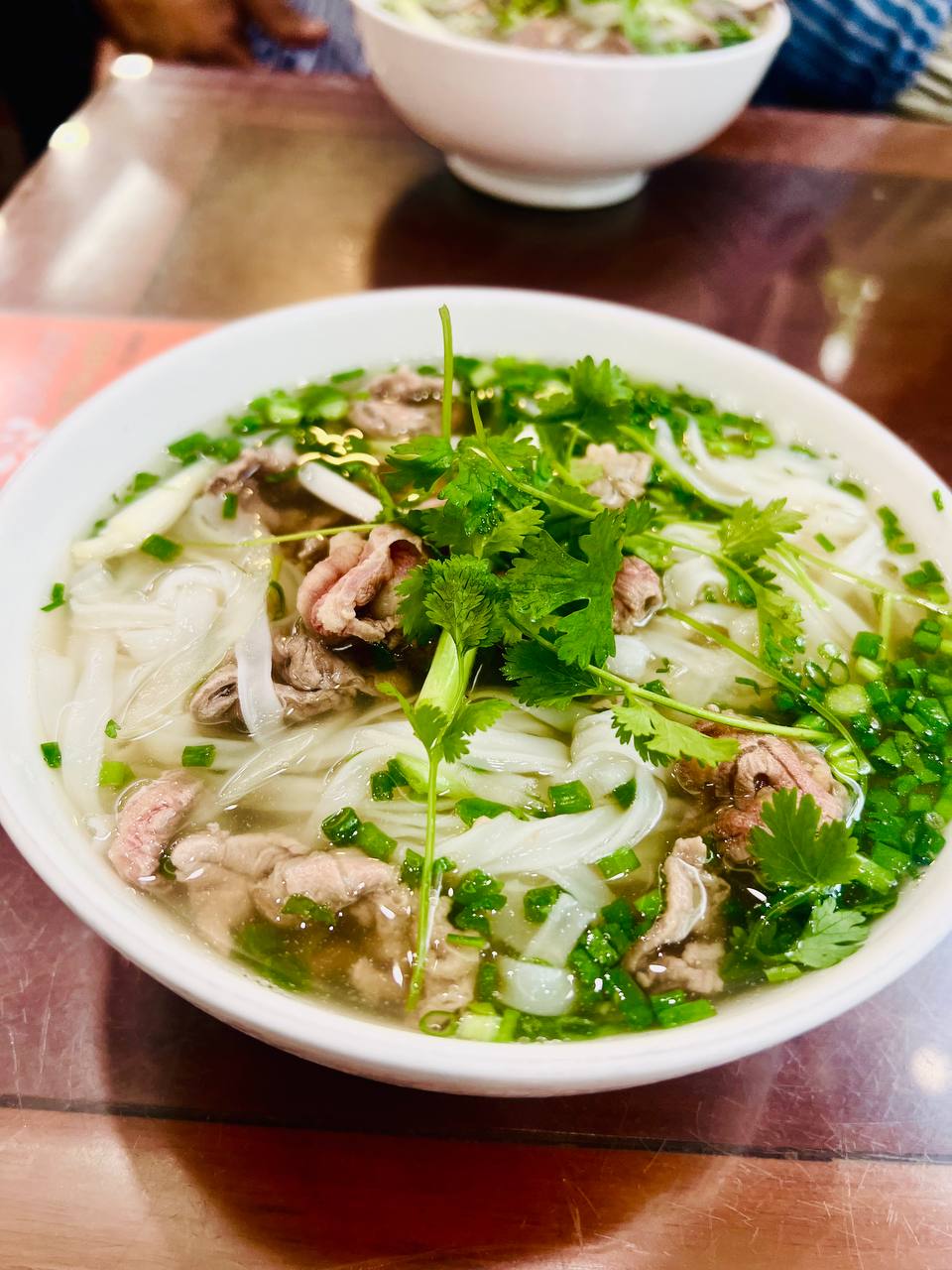The pho — clean broth, thin beef slices, herb-forward